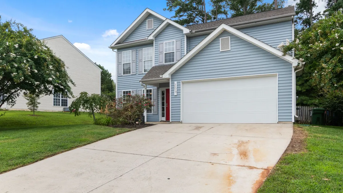 Exterior of a two-story suburban home with fresh paint