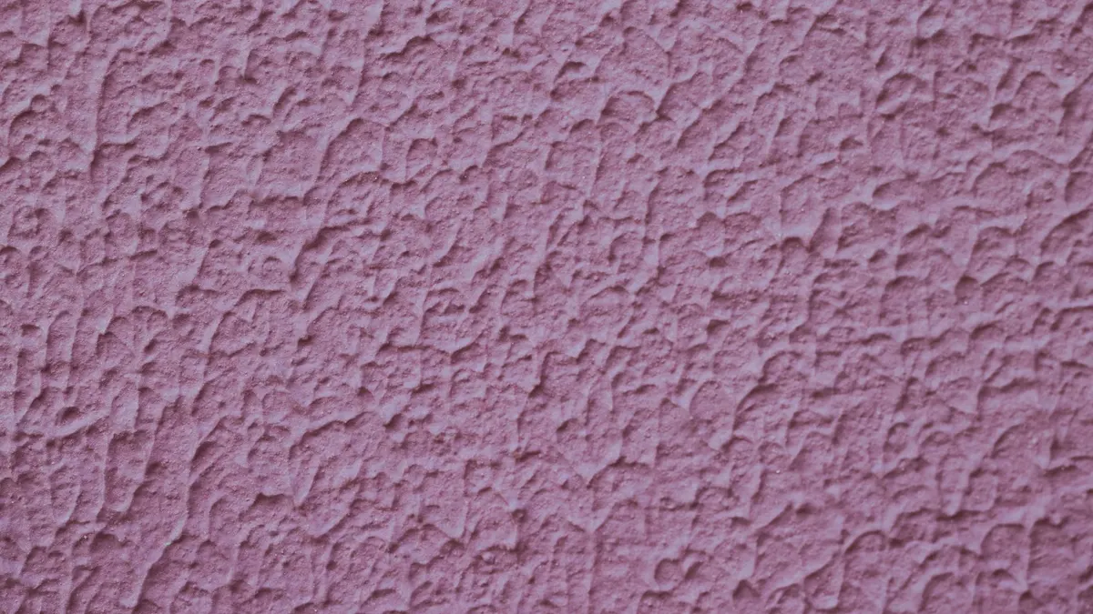 Wall with uneven paint texture and visible patchy spots