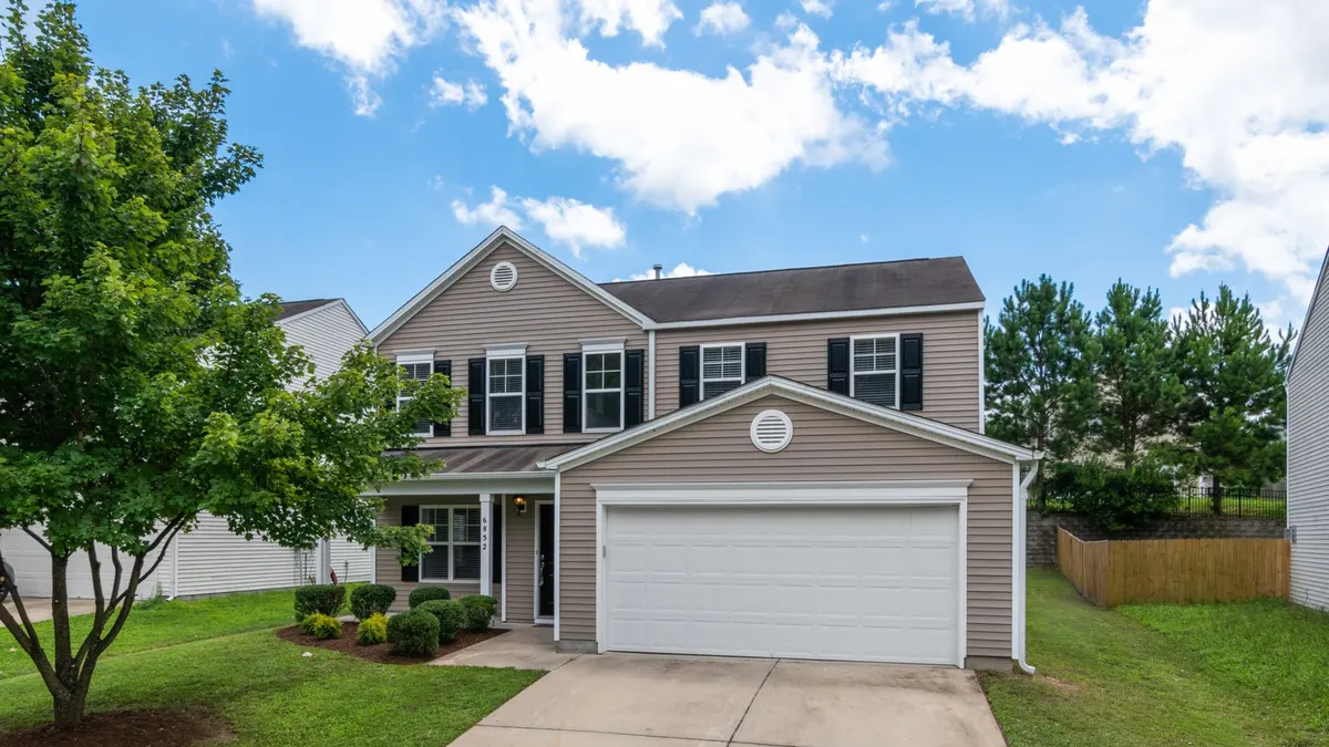 Dark-colored vinyl siding on a house exterior